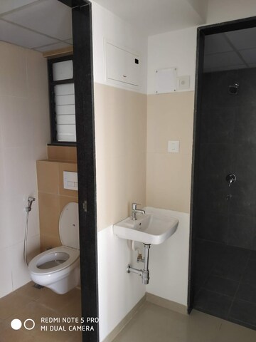 Bathroom in 1 BHK Apartment at Shapoorji Pallonji Joyville Hinjewadi, Hinjewadi – for Sale