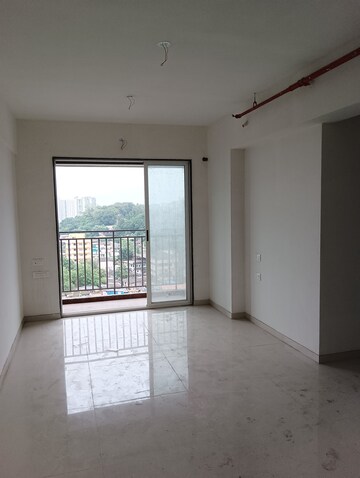 Living Room in 1 BHK Apartment at Ajmera Crosstown One, Kalyan West – for Rent