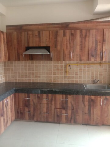 Kitchen in 2 BHK Apartment at Mahagun Mywoods, Sector 16c Greater Noida – for Rent