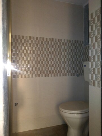 Bathroom in 1 BHK Apartment at Dharti Orange Heights, Morya Nagar – for Rent