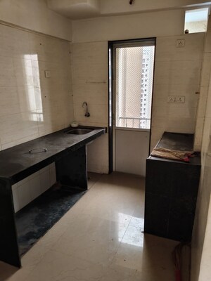 Kitchen in 2 BHK Apartment at Green Vatika CHS, Kandivali East – for Sale