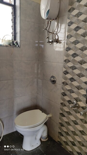 Bathroom in 1 BHK Apartment at Bhagwati Belmont, Haware City – for Rent