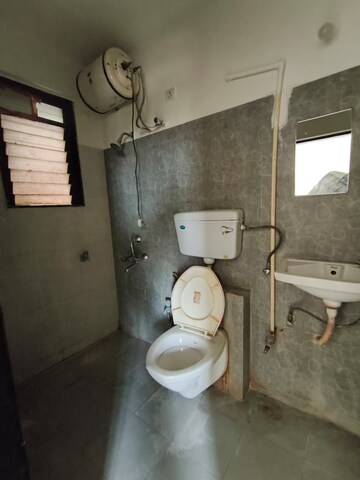 Bathroom in 1 BHK Apartment at Raunak Bliss, Ghodbunder Road – for Rent