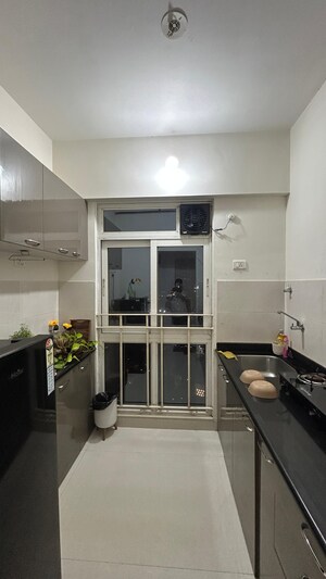 Kitchen in 1 BHK Apartment at Vijay Orovia, Ghodbunder Road – for Sale