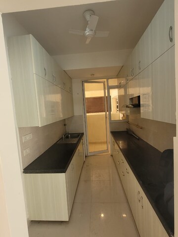 Kitchen in 3 BHK Apartment at Mahagun Mirabella, Sector 79 – for Rent