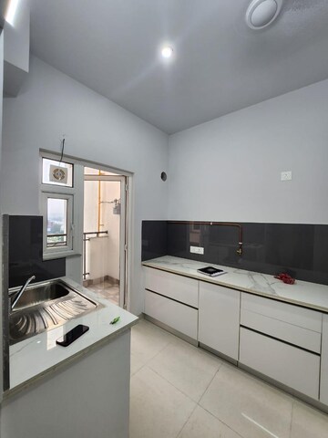 Kitchen in 3 BHK Builder Floor at Central Park Flower Valley Aqua Front Towers, Sohna Sector 33 – for Rent