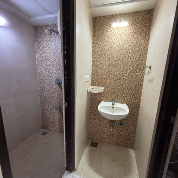 Bathroom in 1 BHK Apartment at Lodha Lakeshore Greens, Hedutane – for Rent