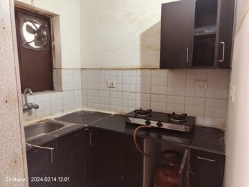 Kitchen in Studio Apartment at Jaipurias Sunrise Greens Zirakpur, Vip Road – for Rent