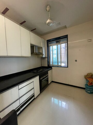 Kitchen in 2.5 BHK Apartment at Rustomjee Urbania Athena, Majiwada – for Rent