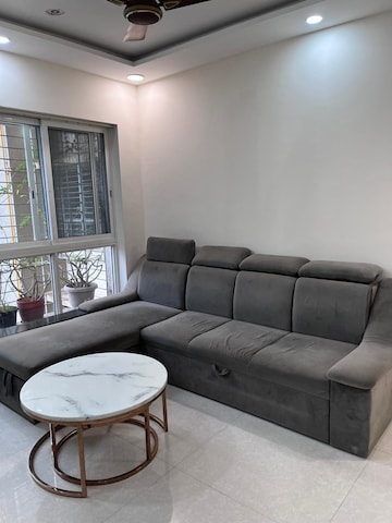 Living Room in 1 BHK Apartment at Lodha Amara, Kolshet Road – for Rent