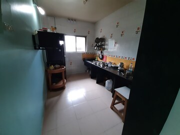 Kitchen in 2 BHK Apartment at Nirmal Township CHS B5 Building, Sinhagad Road – for Sale