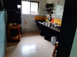Kitchen in 2 BHK Apartment at Nirmal Township CHS B5 Building, Sinhagad Road – for Sale