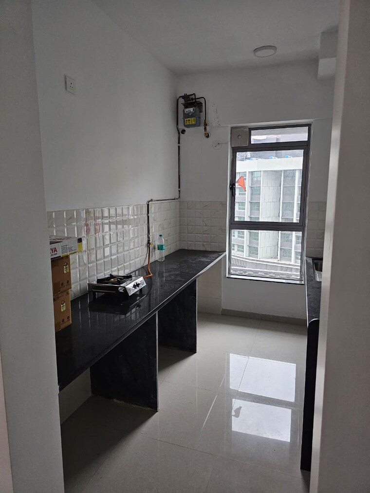 Kitchen, kalpataru-immensa 2 Bedroom 650 Sq.Ft. Apartment In Kolshet Road Thane 9180471