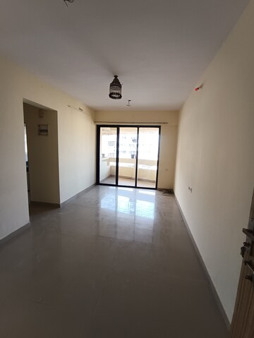 Living Room in 1 BHK Apartment at Ajmera Yogi Dham Phase III, Kalyan West – for Rent