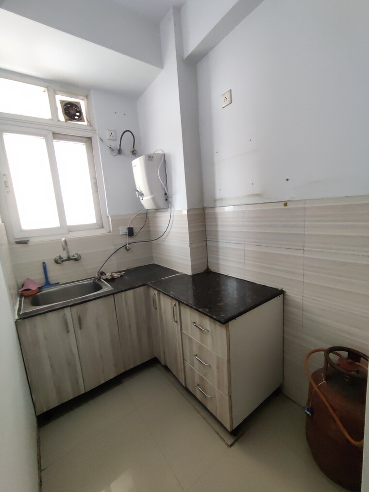 Kitchen, rishabh-cloud-9 1.5 Bedroom 600 Sq.Ft. Apartment In Sector 1 Vaishali Ghaziabad 9180895