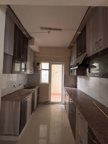 Kitchen in 3 BHK Apartment at Paramount Emotions, Sector 1 Greater Noida – for Rent