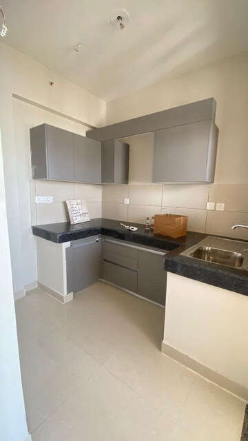 Kitchen in 2 BHK Apartment at Tata Eureka Park, Sector 150 – for Rent