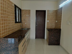 Kitchen in 2 BHK Apartment at Om Tropica, Ravet – for Sale