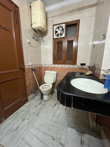 Bathroom in 4 BHK Apartment at Chattarpur – for Rent