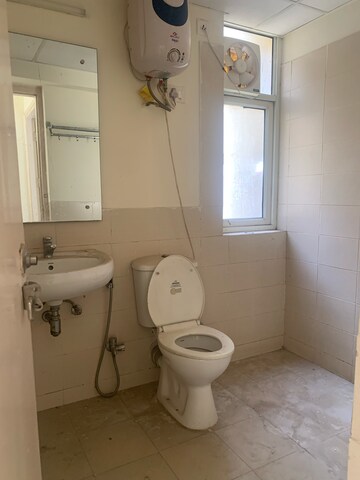 Bathroom in 4 BHK Apartment at Piedmont Taksila Heights, Sector 37c – for Rent