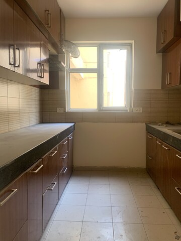 Kitchen in 4 BHK Apartment at Piedmont Taksila Heights, Sector 37c – for Rent