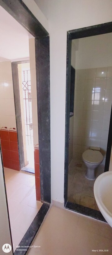 Bathroom in 1 BHK Apartment at Puraniks Kavya Dhara CHS, Dhokali – for Rent