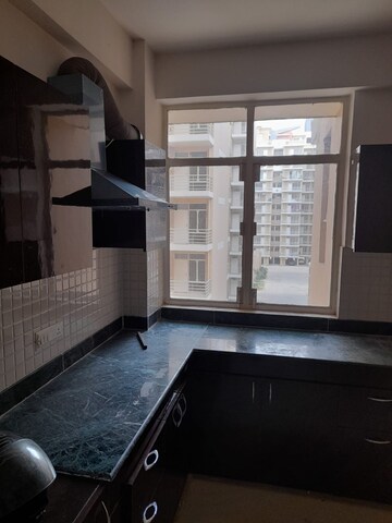 Kitchen in 2 BHK Apartment at Breez Global Heights, Sohna Sector 33 – for Sale