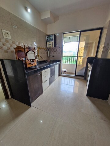 Kitchen in 1 BHK Apartment at Munisuvrat Viaan Classic, Virar West – for Sale