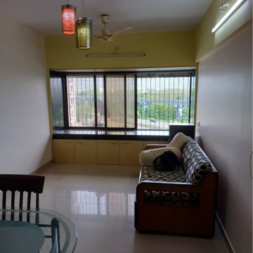 Living Room in 1 BHK Apartment at Ajmera Valencia, Bhakti Park – for Rent