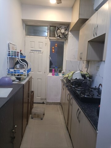 Kitchen in 2 BHK Apartment at Amrapali Silicon City, Sector 76 – for Rent