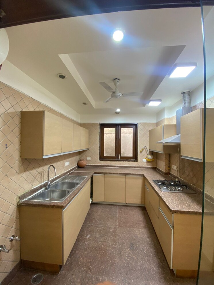 Kitchen, uday park 3 Bedroom 217 Sq.Yd. Builder Floor In Uday Park Delhi 9185456