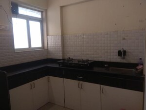 Kitchen in 1 BHK Apartment at Unnathi Woods Phase 3, Ghodbunder Road – for Sale