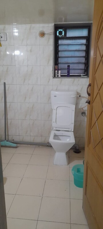 Bathroom in 1 BHK Apartment at Raunak Unnathi Woods Phase 3, Ghodbunder Road – for Sale