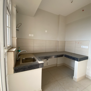 Kitchen in 2 BHK Apartment at Tata Eureka Park, Sector 150 – for Rent