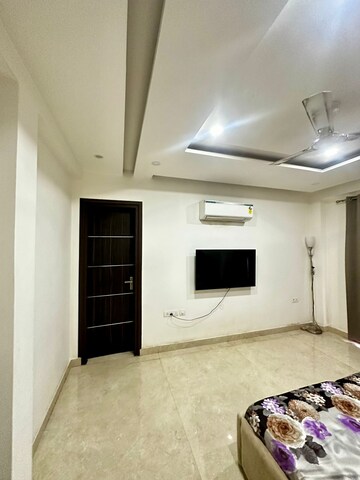 Bedroom in 4 BHK Builder Floor at Sushant Lok ii – for Rent