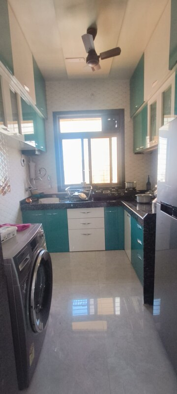 Kitchen in 2 BHK Apartment at KD Niraj Exotica, Khadakpada – for Sale