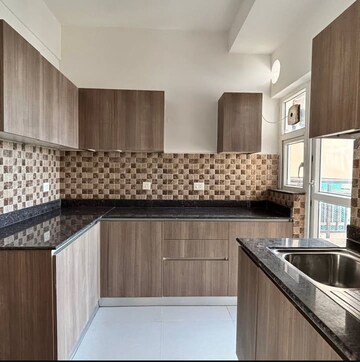 Kitchen in 3 BHK Apartment at Adani M2K Oyster Grande, Sector 102 – for Sale