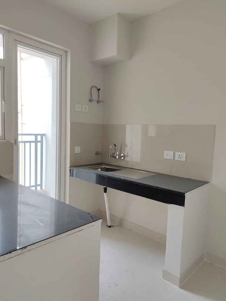 Kitchen, eldeco-live-by-the-greens 2 Bedroom 1137 Sq.Ft. Apartment In Sector 150 Noida 9186796