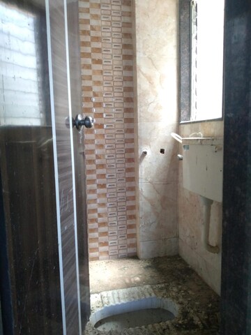 Bathroom in 1 BHK Apartment at SS Sky Heights, Nalasopara West – for Rent