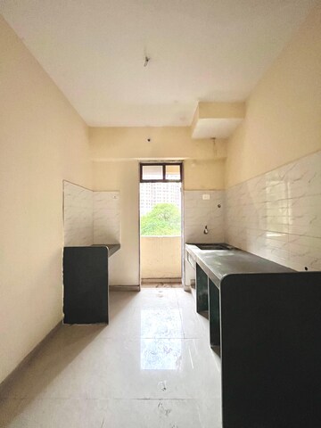Kitchen in 1 BHK Apartment at Paradigm Zenith Pushpanjali Residency Phase III, Ghodbunder Road – for Sale