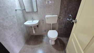 Bathroom in 3 BHK Apartment at Kolte Patil Margosa Heights, Mohammadwadi – for Rent