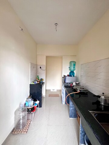 Team Area in 1 BHK Apartment at Paradigm Zenith Pushpanjali Residency Phase III, Ghodbunder Road – for Rent