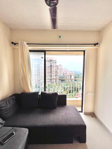 Living Room in 1 BHK Apartment at Paradigm Zenith Pushpanjali Residency Phase III, Ghodbunder Road – for Rent