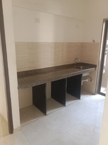 Kitchen in 1 BHK Apartment at Sunteck West World, Tivri – for Sale