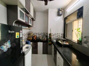 Kitchen in 2 BHK Apartment at Swastik Residency Phase II CHS Ltd, Ghodbunder Road – for Rent