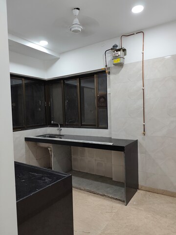 Kitchen in 2 BHK Apartment at Rajvi Ashtavinayak, Andheri West – for Sale