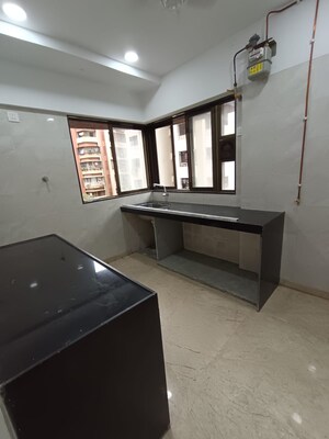 Kitchen in 2 BHK Apartment at Rajvi Ashtavinayak, Andheri West – for Sale
