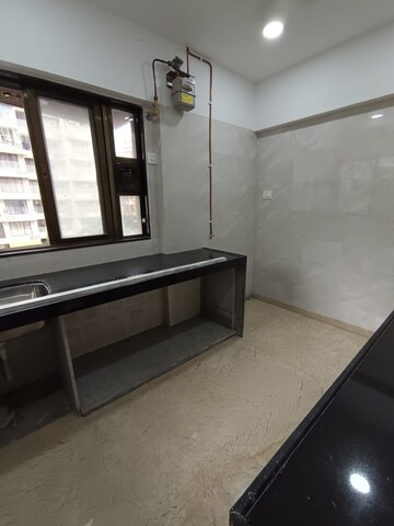 Kitchen in 2 BHK Apartment at Rajvi Ashtavinayak, Andheri West – for Sale