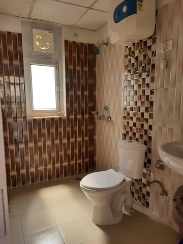 Bathroom in 3 BHK Apartment at Ansal API Celebrity Gardens, Sushant Golf City – for Rent
