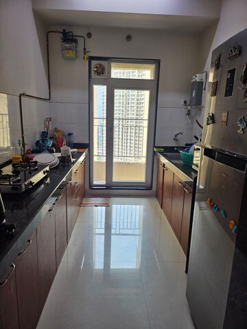 Kitchen in 2 BHK Apartment at Rustomjee Azziano Wing D, Thane West – for Rent